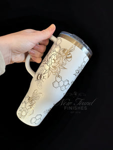 360 bee and flowers laser engraved 40oz tumbler with handle and straw.