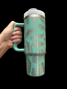 360 feather teal and silver laser engraved 30 oz tumbler with handle and straw.