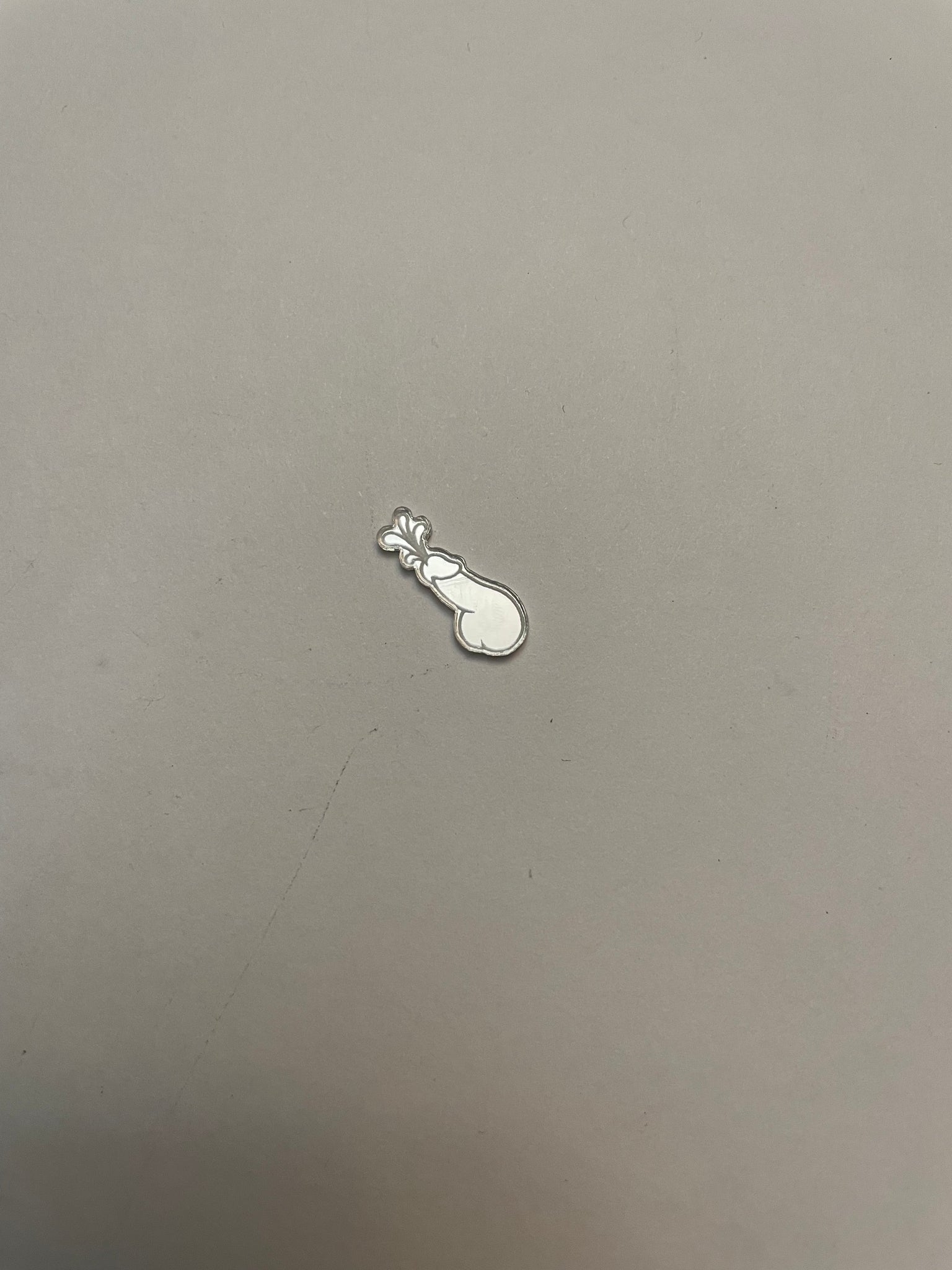 Tiny squirting phallus tag